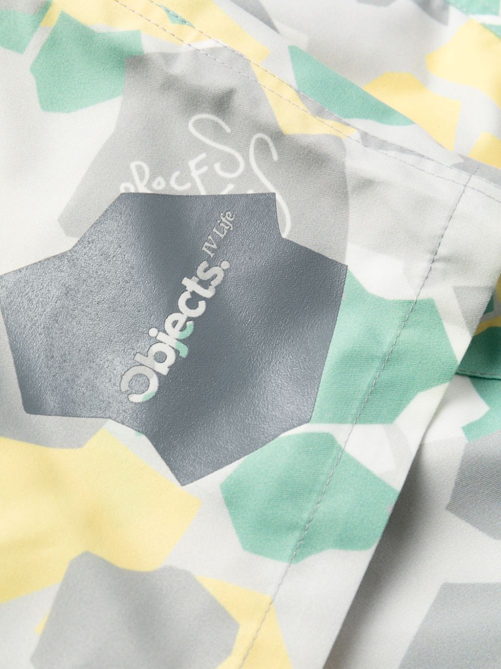 camouflage-pattern swim shorts